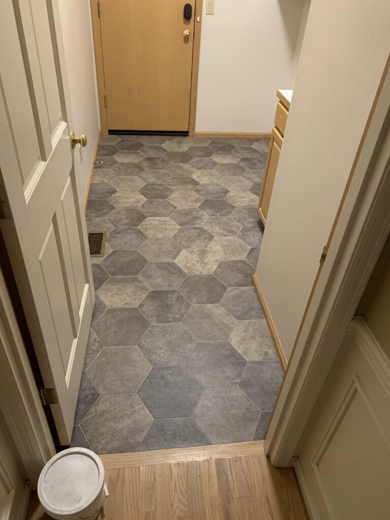 Gray hexagon tile flooring. Flooring services near me.