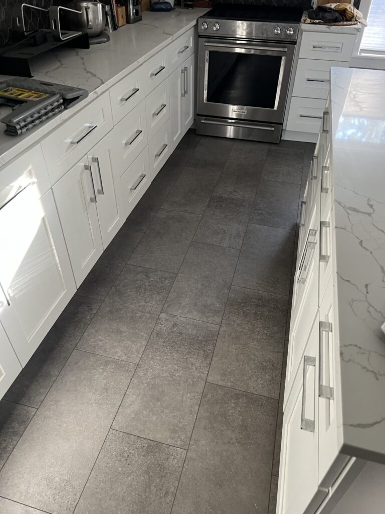 Dark tile flooring in a kitchen. Home improvement. Flooring installation Seattle
