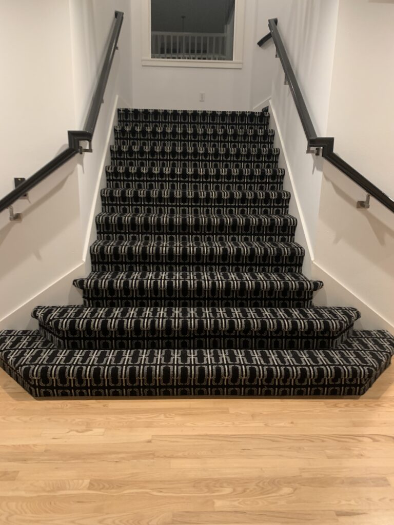 Black carpet on the stairs. 