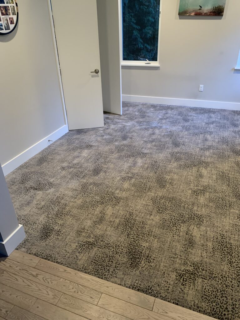 Gray carpet in a bedroom. Home improvement.